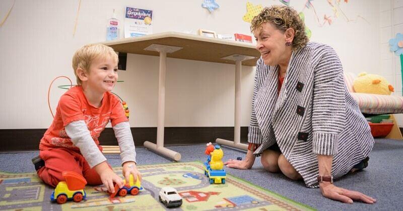 ​Roberta Michnick Golinkoff plays cars with a child